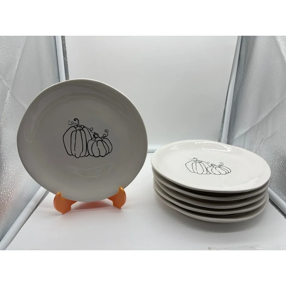 Pier 1 Imports stoneware dessert plates with a black and white pumpkin pattern.